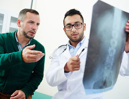 Physician and patient discussing xray
